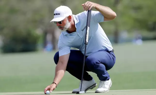 Paul Waring places his ball on the 17th green during the first round of the Texas Children's Houston Open golf tournament Thursday, March 26, 2026, in Houston. (AP Photo/Michael Wyke)