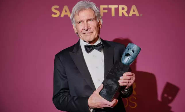 Harrison Ford poses in the press room with the lifetime achievement award during the 32nd Annual Actor Awards on Sunday, March 1, 2026, at the Shrine Auditorium and Expo Hall in Los Angeles. (Photo by Jordan Strauss/Invision/AP)