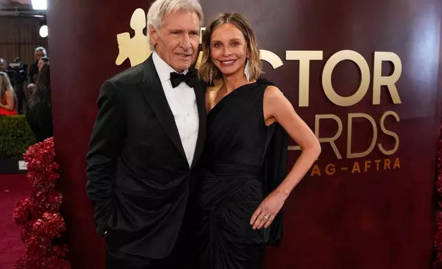 Harrison Ford, left, and Calista Flockhart arrive at the 32nd Annual Actor Awards on Sunday, March 1, 2026, at the Shrine Auditorium and Expo Hall in Los Angeles. (AP Photo/Chris Pizzello)