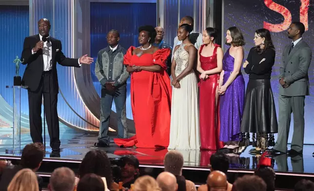 Delroy Lindo, from left, Miles Canton, Wunmi Mosaku, Omar Benson Miller, Jayme Lawson, Li Jun Li, Lola Kirke, Francine Maisler, and Michael B. Jordan accept the award for outstanding performance by a cast in a motion picture for "Sinners" during the 32nd Annual Actor Awards on Sunday, March 1, 2026, at the Shrine Auditorium and Expo Hall in Los Angeles. (AP Photo/Chris Pizzello)