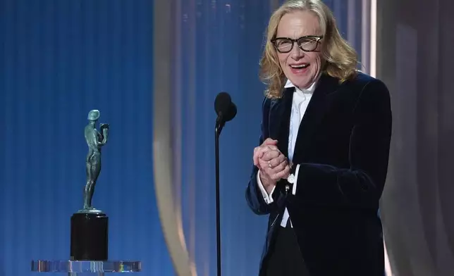 Amy Madigan accepts the award for outstanding performance by a female actor in a supporting role for "Weapons" during the 32nd Annual Actor Awards on Sunday, March 1, 2026, at the Shrine Auditorium and Expo Hall in Los Angeles. (AP Photo/Chris Pizzello)