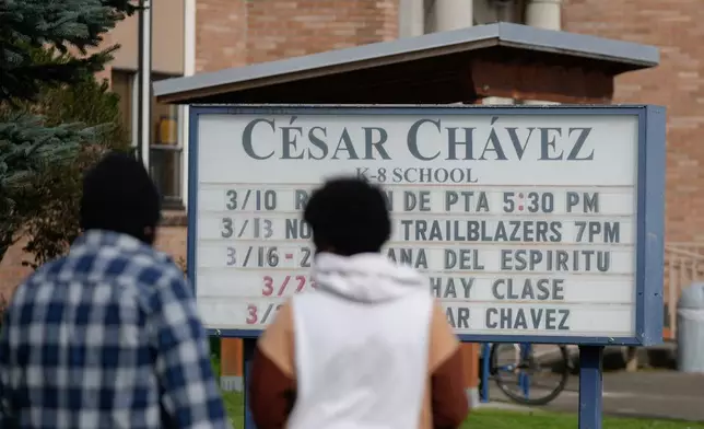 A sign for Cesar Chavez School is seen on Wednesday, March 18, 2026, in Portland, Ore. (AP Photo/Jenny Kane)