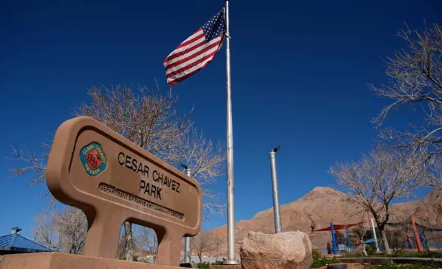 A sign advertises César Chavez Park, Thursday, March 19, 2026, in Las Vegas. (AP Photo/John Locher)