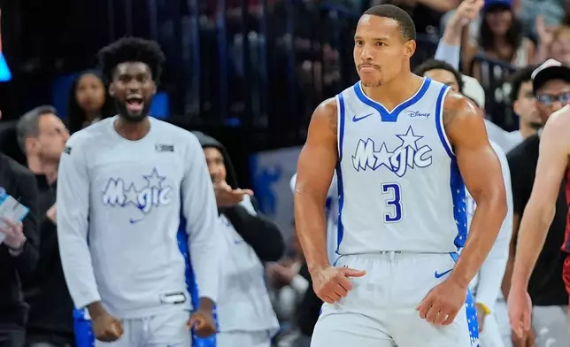 Orlando Magic guard Desmond Bane (3) reacts after sinking a 3-point shot against the Cleveland Cavaliers during the second half of an NBA basketball game, Wednesday, March 11, 2026, in Orlando, Fla. (AP Photo/John Raoux)