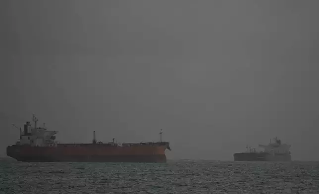 Russian-flagged oil tanker Anatoly Kolodki, right, approaches Matanzas, Cuba, Tuesday, March 31, 2026.. (AP Photo/Ramon Espinosa)
