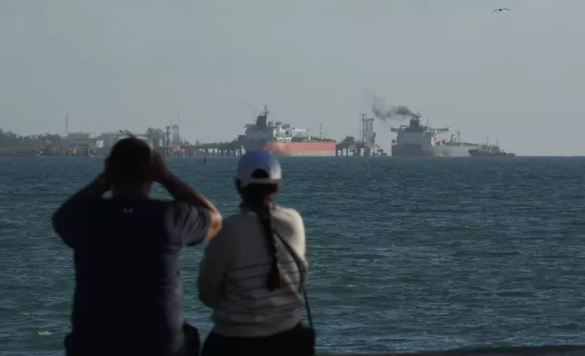 Russian-flagged oil tanker Anatoly Kolodkin, right, docks at an oil terminal in Matanzas, Cuba, Tuesday, March 31, 2026. (AP Photo/Ramon Espinosa)