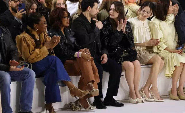Oprah Winfrey, from left, Gayle King, Adam Long, Aimee Lou Wood and Maude Apatow attend the Chloe Fall/Winter 2026-2027 Women's collection presented in Paris, Thursday, March 5, 2026. (AP Photo/Tom Nicholson)