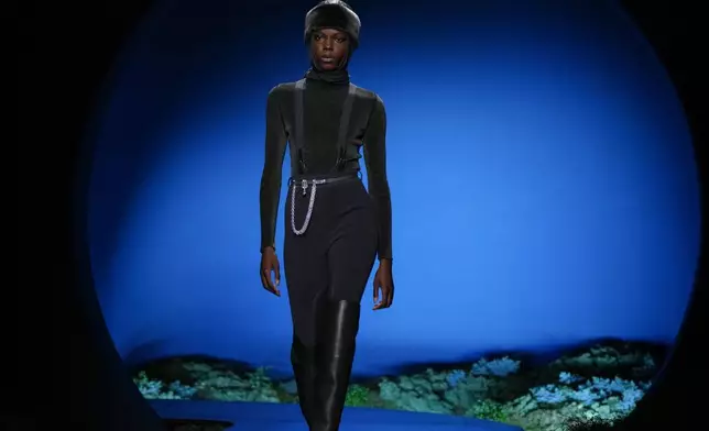 A model wears a creation as part of the Hermes Fall/Winter 2026-2027 Women's collection presented in Paris, Saturday, March 7, 2026. (AP Photo/Aurelien Morissard)