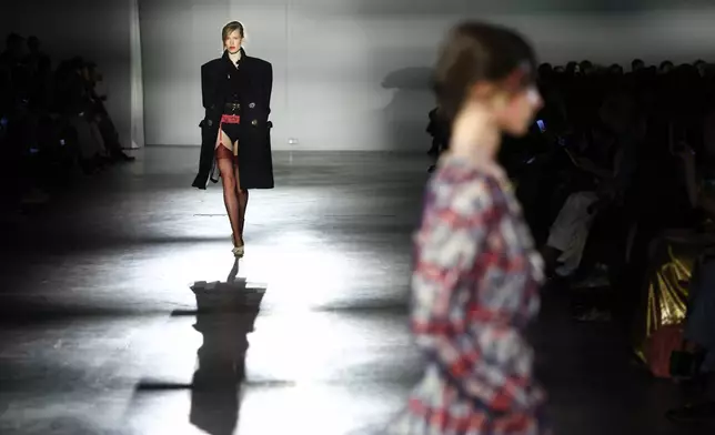 A model wears a creation from the Vivienne Westwood Fall/Winter 2026-2027 Women's collection presented in Paris, Saturday, March 7, 2026. (AP Photo/Tom Nicholson)