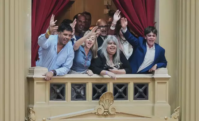 FILE - Attendees react to President Javier Milei's annual State of the Nation address at Congress in Buenos Aires, Argentina, March 1, 2026. (AP Photo/Gustavo Garello, File)