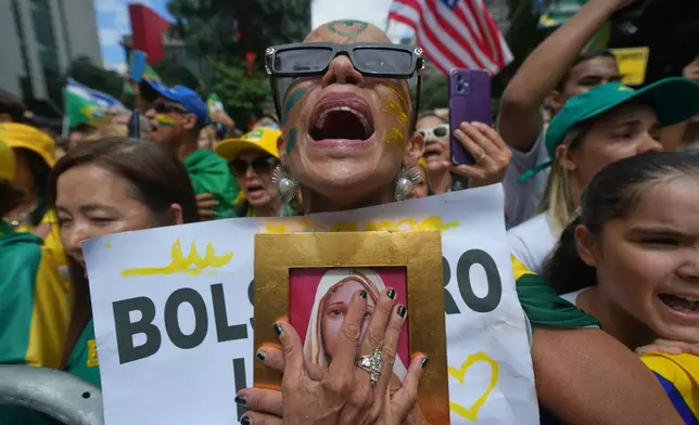 FILE - Supporters of former President Jair Bolsonaro protest against President Luiz Inacio Lula da Silva in Sao Paulo, March 1, 2026. (AP Photo/Andre Penner, File)