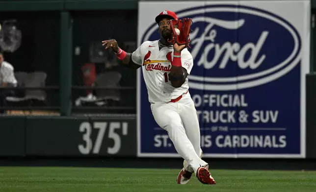 St. Louis Cardinals right fielder Jordan Walker catches a fly ball hit by New York Mets' Carson Benge in the eighth inning of a baseball game, Monday, March 30, 2026, in St. Louis. (AP Photo/Joe Puetz)