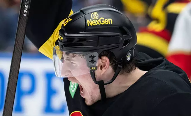 Vancouver Canucks' Drew O'Connor (18) reacts to a goal during the second period of an NHL hockey game against the Florida Panthers in Vancouver, Tuesday, March 17, 2026. (Ethan Cairns/The Canadian Press via AP)