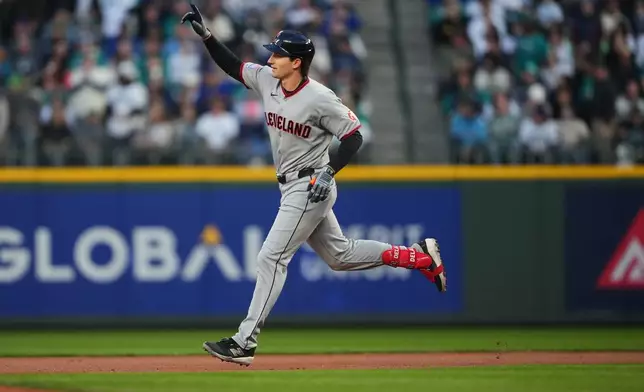 Cleveland Guardians' Chase DeLauter jogs the bases after hitting a solo home run against Seattle Mariners starting pitcher Logan Gilbert during the first inning of an opening-day baseball game, Thursday, March 26, 2026, in Seattle. (AP Photo/Lindsey Wasson)