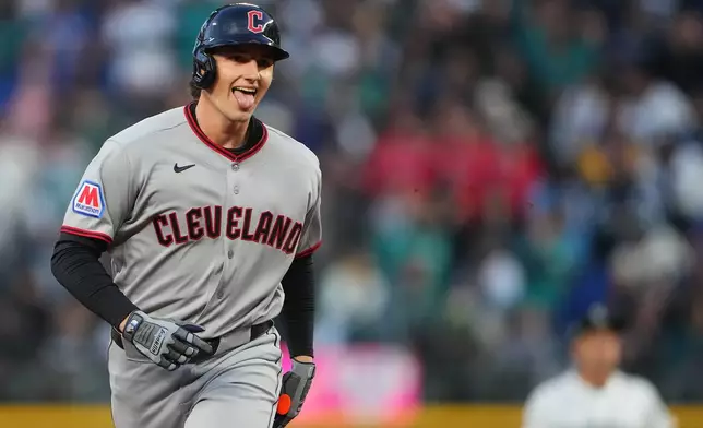Cleveland Guardians' Chase DeLauter jogs the bases after hitting a solo home run against Seattle Mariners starting pitcher Logan Gilbert during the first inning of an opening-day baseball game, Thursday, March 26, 2026, in Seattle. (AP Photo/Lindsey Wasson)