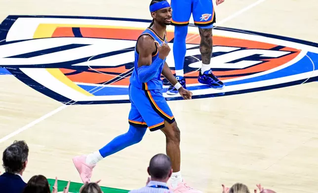 Oklahoma City Thunder guard Shai Gilgeous-Alexander (2) gestures during the second half of an NBA basketball game against the Denver Nuggets Monday, March 9, 2026, in Oklahoma City. (AP Photo/Gerald Leong)