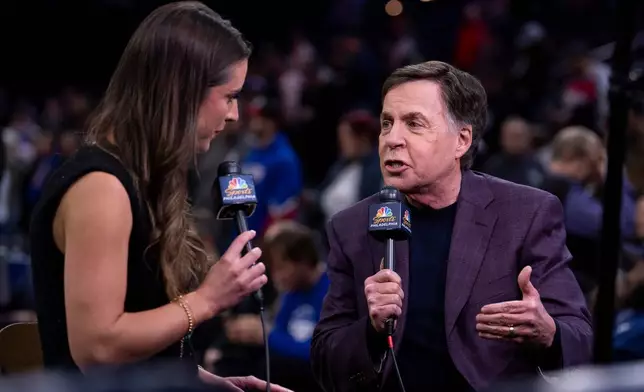 NBC NBA announcer Bob Costas, right, gets interviewed by NBCSports Philadelphia's Ashlyn Sullivan, left, prior to an NBA basketball game between the San Antonio Spurs and the Philadelphia; 76ers, Tuesday, March 3, 2026, in Philadelphia. (AP Photo/Chris Szagola)