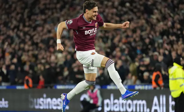 West Ham's Konstantinos Mavropanos celebrates scoring his side's first goal during the English Premier League soccer match between West Ham United and Manchester City in London, England, Saturday, March 14, 2026. (AP Photo/Dave Shopland)
