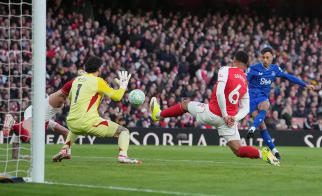 Everton's Dwight McNeil shoots during the English Premier League soccer match between Arsenal and Everton in London, England, Saturday, March 14, 2026. (AP Photo/Kin Cheung)