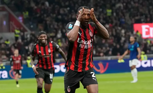 AC Milan's Pervis Estupinan celebrates after scoring the opening goal during the Serie A soccer match between AC Milan and Inter Milan, in Milan, Italy, Sunday, March 8, 2026. (AP Photo/Luca Bruno)