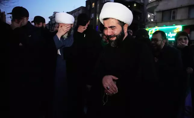 Clerics and other government supporters mourn in a gathering after state TV officially announced the death of Iranian Supreme Leader Ayatollah Ali Khamenei, in Tehran, Iran, Sunday, March 1, 2026. (AP Photo/Vahid Salemi)