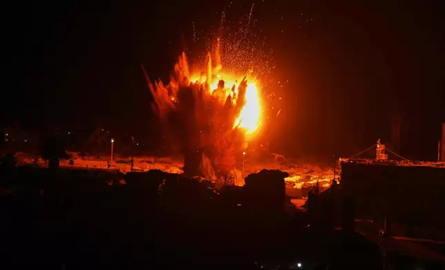 An Israeli army strike explodes next to a tent camp after residents were given a warning to evacuate before the strike in Gaza City, Wednesday, March 11, 2026. (AP Photo/Yousef Al Zanoun)