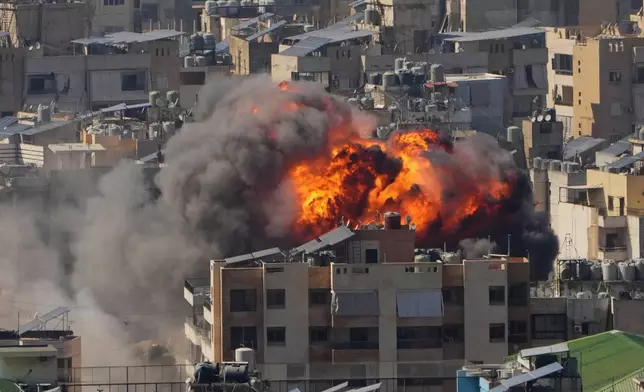 Flames rise after an Israeli airstrike in Dahiyeh Beirut's southern suburbs, Monday, March 9, 2026. (AP Photo/Hassan Ammar)