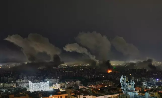 Smoke rises from buildings following an Israeli airstrike in Dahiyeh, Beirut's southern suburbs, Lebanon, Wednesday, March 11, 2026. (AP Photo/Bilal Hussein)
