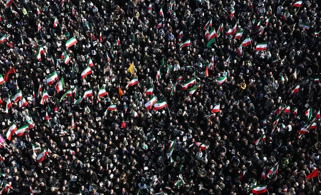 People gather in a rally to support Ayatollah Mojtaba Khamenei, the successor to his late father Ayatollah Ali Khamenei as supreme leader, in Tehran, Iran, Monday, March 9, 2026. (AP Photo/Vahid Salemi)