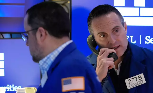 Michael Gagliano works on the floor at the New York Stock Exchange in New York, Friday, March 6, 2026. (AP Photo/Seth Wenig)