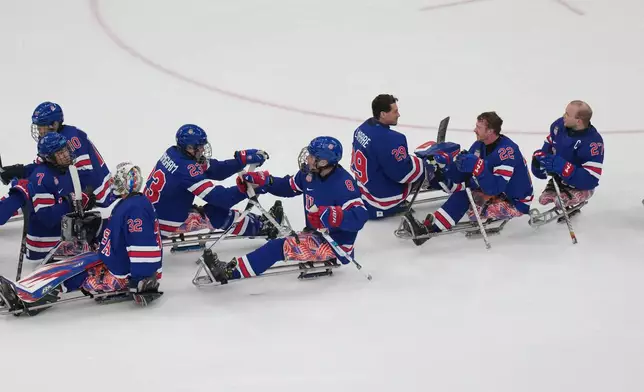 United States' players reacts after winning the Group A hockey match between United States' and Italy at the 2026 Winter Paralympics, in Milan, Italy, Saturday, March 7, 2026. (AP Photo/Antonio Calanni)