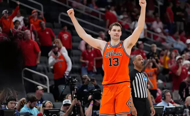 Illinois center Tomislav Ivisic (13) reacts after defeating Houston in the Sweet 16 of the NCAA college basketball tournament Friday, March 27, 2026, in Houston. (AP Photo/Ashley Landis)