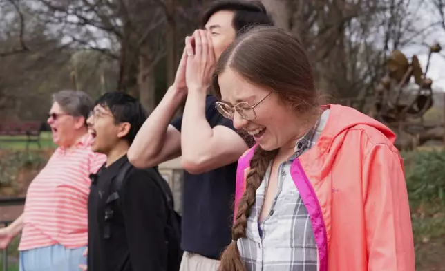 Sarah Woolson participates in a Scream Club meeting at Piedmont Park, Sunday, March 8, 2026, in Atlanta. (AP Photo/Emilie Megnien)