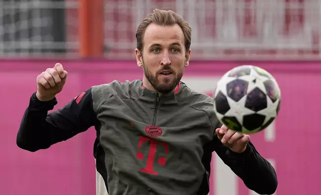 Bayern's Harry Kane stops a ball during a training session in Munich, Germany, Monday, March 9, 2026, ahead of the Champions League round of 16 soccer match between Atalanta Bergamo and FC Bayern. (AP Photo/Matthias Schrader)