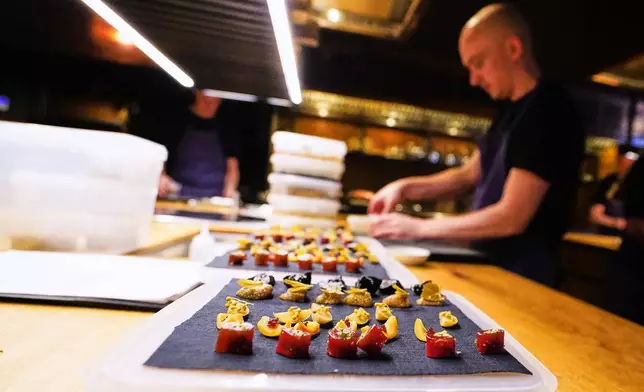 Chiefs prepare food at the restaurant Kadeau in Copenhagen, Denmark, Feb. 12, 2026. (AP Photo/James Brooks)