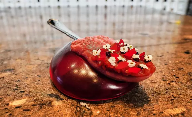 A dish named "Tongue Kiss" served at restaurant Alchemist in Copenhagen, Denmark, Feb. 11, 2026. (AP Photo/James Brooks)