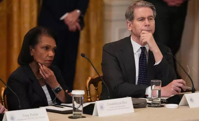 Former U.S. Secretary of State Condoleezza Rice and Treasury Secretary Scott Bessent attend a roundtable discussion on college sports in the East Room of the White House, Friday, March 6, 2026, in Washington. (AP Photo/Julia Demaree Nikhinson)