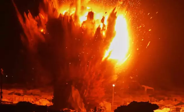 FILE - An Israeli army strike hits next to a tent camp after residents were given a warning to evacuate before the strike in Gaza City, March 11, 2026. (AP Photo/Yousef Al Zanoun, File)