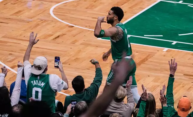 Boston Celtics forward Jayson Tatum blows a kiss to fans after making a 3-pointer against the Dallas Mavericks during the second half of an NBA basketball game, Friday, March 6, 2026, in Boston. (AP Photo/Charles Krupa)
