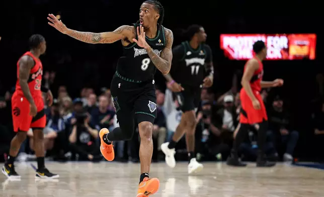 Minnesota Timberwolves guard Bones Hyland (8) celebrates his 3-point basket against the Toronto Raptors during the first half of an NBA basketball game, Thursday, March 5, 2026, in Minneapolis. (AP Photo/Matt Krohn)