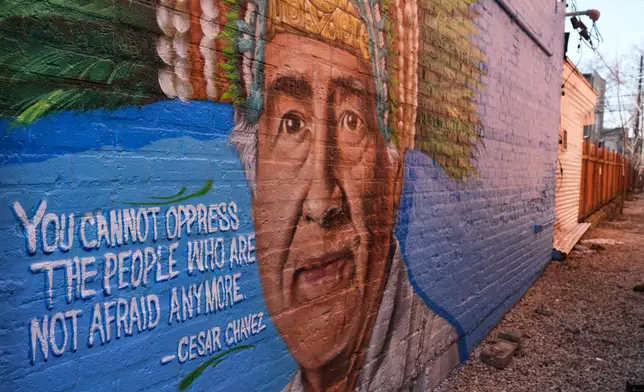 FILE - A Cesar Chavez mural blankets the exterior of a building in Chicago, March 19, 2026. (AP Photo/Nam Y. Huh, File)