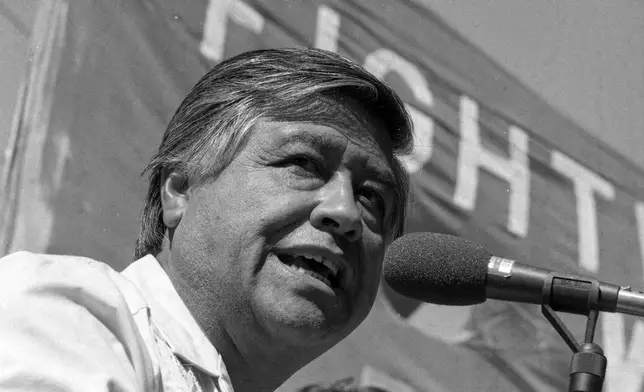 FILE - United Farm Workers president César Chavez leads a strike to kick off the "Hispanics Say No!" campaign directed at voters in opposition of ballot measures in November, at Bruno's Restaurant in the Mission District of San Francisco on Sept. 26, 1984. (Eric Luse/San Francisco Chronicle via AP, File)