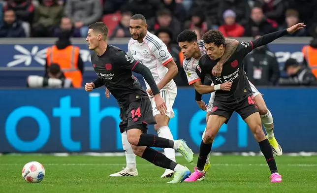 From left, Leverkusen's Patrik Schick, Bayern's Jonathan Tah, Bayern's Luis Diaz, Leverkusen's Montrell Culbreath in action during a German Bundesliga soccer match between Bayer Leverkusen and Bayern Munich in Leverkusen, Germany, Saturday, March 14, 2026. (AP Photo/Martin Meissner)