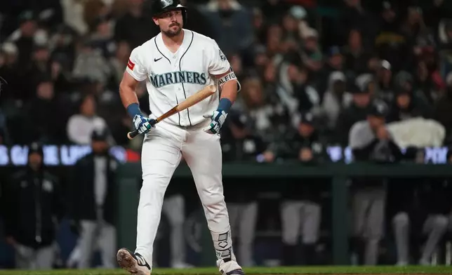 Seattle Mariners' Cal Raleigh reacts after striking out against the New York Yankees during the seventh inning of a baseball game, Monday, March 30, 2026, in Seattle. (AP Photo/Lindsey Wasson)