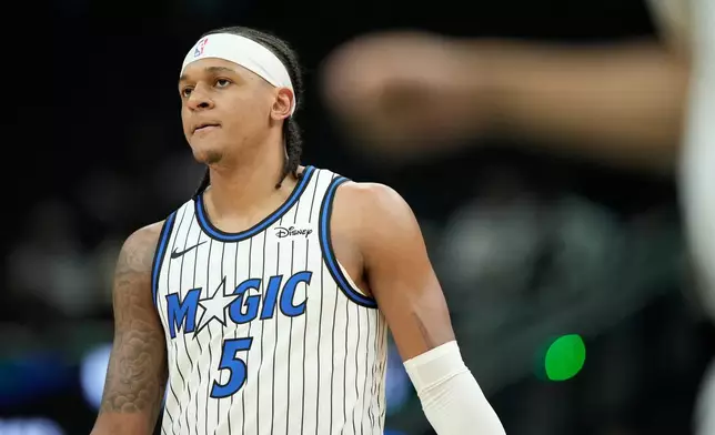 Orlando Magic's Paolo Banchero looks on during the first half of an NBA basketball game against the Milwaukee Bucks, Sunday, March 8, 2026, in Milwaukee. (AP Photo/Aaron Gash)