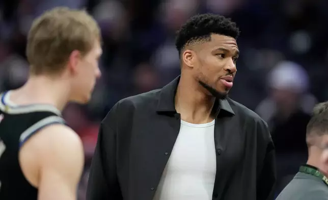 Milwaukee Bucks' Giannis Antetokounmpo looks on during the first half of an NBA basketball game against the Orlando Magic, Sunday, March 8, 2026, in Milwaukee. (AP Photo/Aaron Gash)