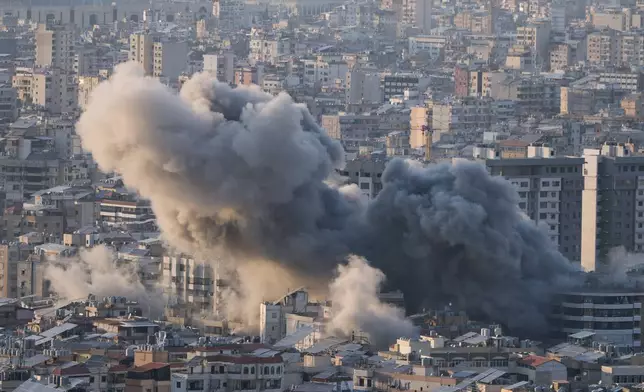 Smoke rises from an Israeli airstrike in Dahiyeh, Beirut's southern suburbs, Lebanon, Tuesday, March 10, 2026. (AP Photo/Bilal Hussein)