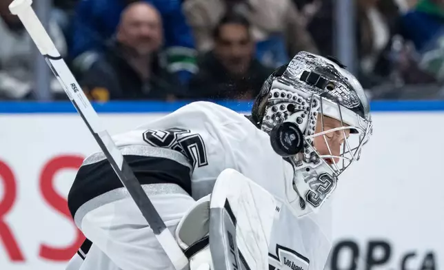 Los Angeles Kings goaltender Darcy Kuemper (35) makes a save during the third period of an NHL hockey game against the Vancouver Canucks in Vancouver, British Columbia, Thursday, March 26, 2026. (Ethan Cairns/The Canadian Press via AP)