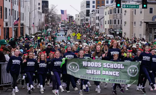 Irish dancers step dance down Dorchester Avenue during the annual St. Patrick's Day parade through the South Boston neighborhood, Sunday, March 15, 2026, in Boston. (AP Photo/Charles Krupa)