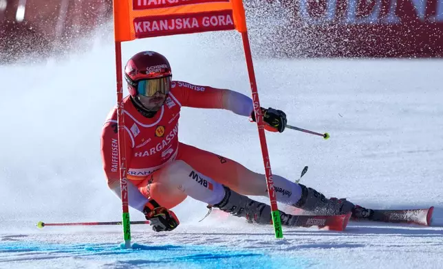 Switzerland's Loic Meillard competes during an alpine ski, men's World Cup giant slalom, in Kranjska Gora, Slovenia, Saturday, March 7, 2026. (AP Photo/Giovanni Auletta)